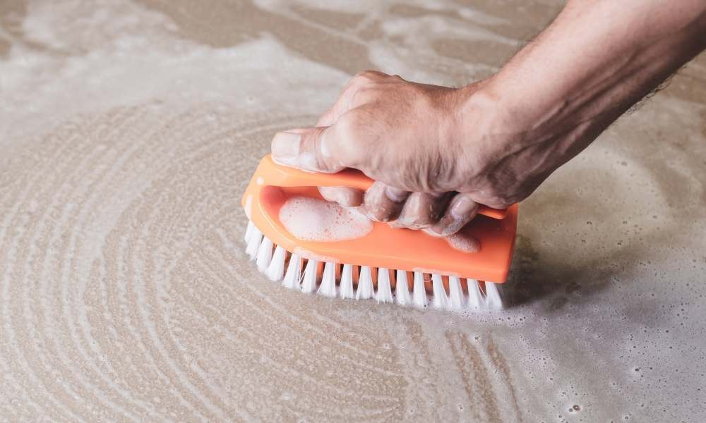 Scrub The Floor With a Brush on The Shower Floor