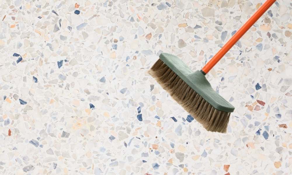Scrub the gravel shower floor with a soft brush