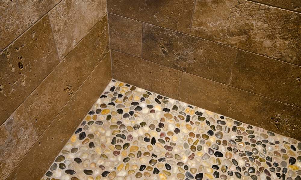 Why is the gravel shower floor popular?