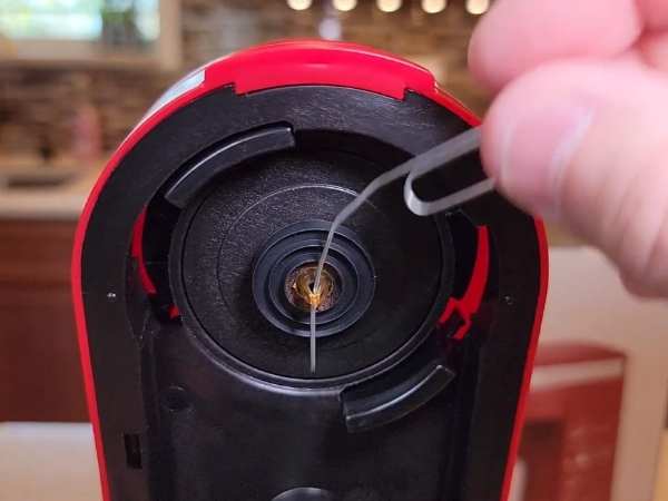 Clean The Coffee Maker Head With a Pin
