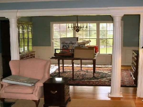 Living Room With White Color Double Pillar