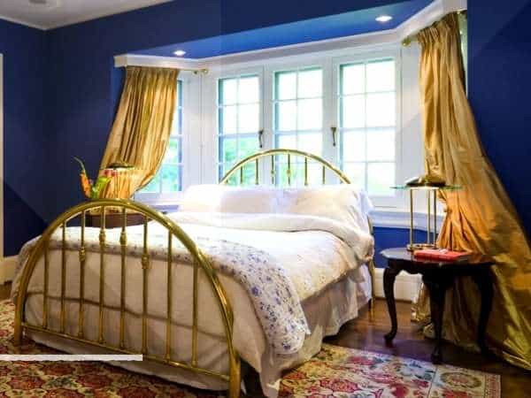 Windows And Curtains in gold and blue bedroom