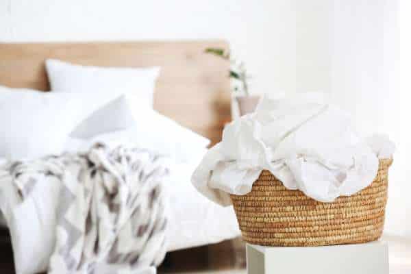 Efficient Methods to Hide a Laundry Basket in Your Bedroom