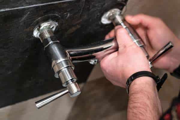 Secure the Faucet with Mounting Nuts